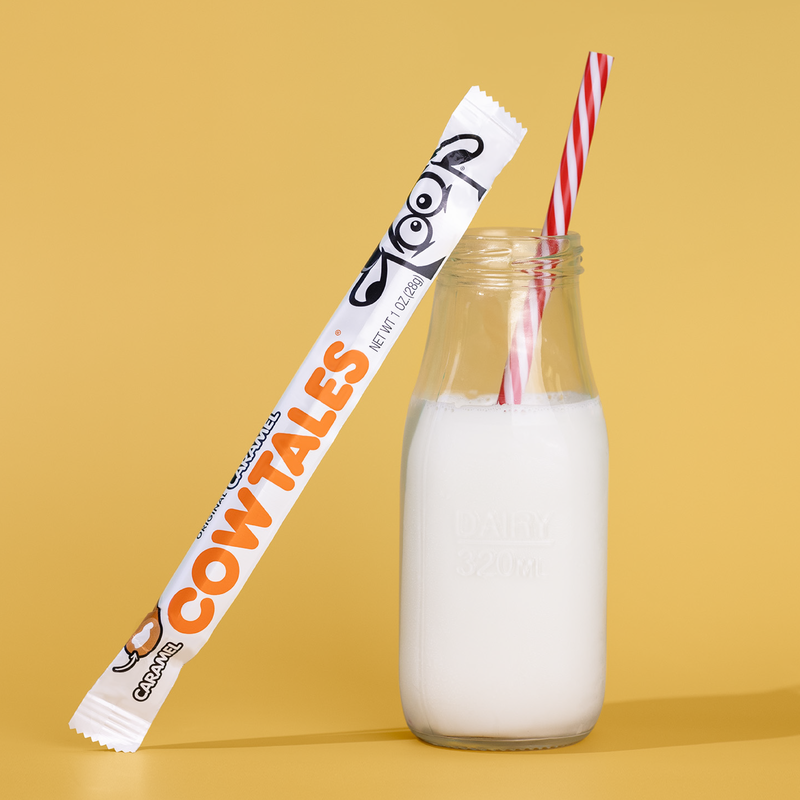 Caramel Cow Tales with Milk and a straw.