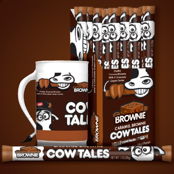 Cow tales carton full of Caramel Brownie Cow Tales and a mug