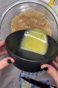 Pouring in beat eggs into mixture