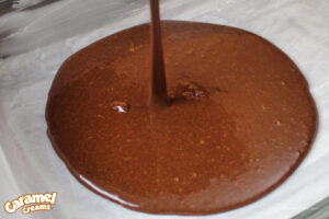 Pouring browning mix into baking dish